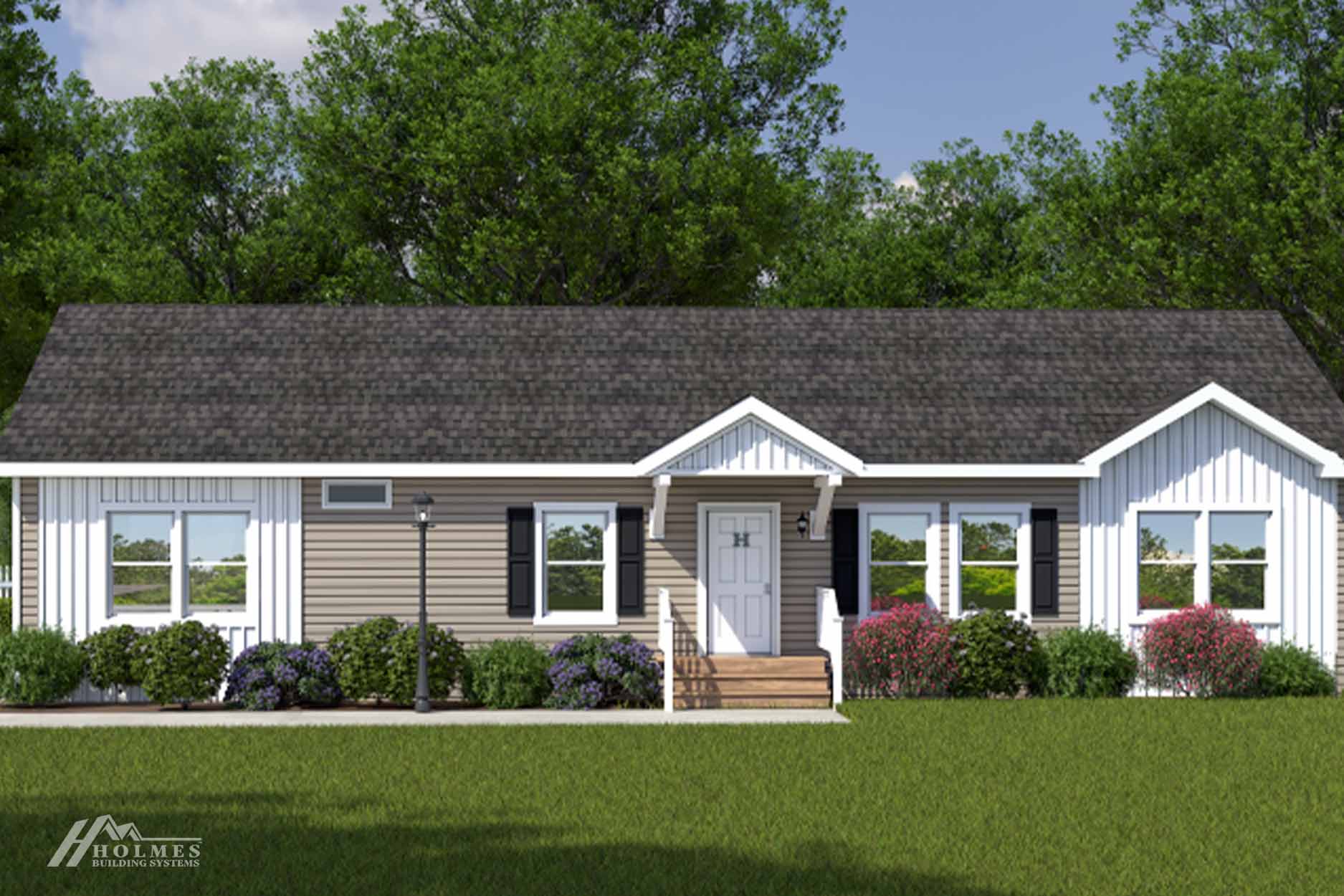 Single-story modular home with gray siding, white trim, front steps, shrubs, and a green lawn; trees in the background.